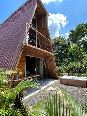 a wooden house with a red roof at Tiny Villa Experience in Fortuna