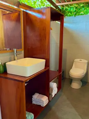 a bathroom with a sink and a toilet at Tiny Villa Experience in Fortuna