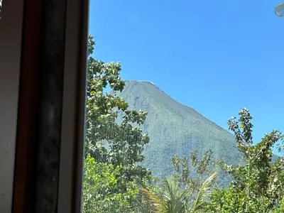 a view of a mountain from a window at Tiny Villa Experience in Fortuna