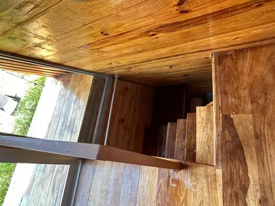 a window in a wooden wall with a knife at Tiny Villa Experience in Fortuna