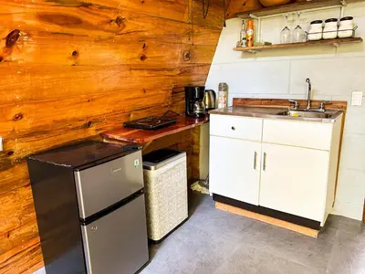 a kitchen with a sink and a counter top at Tiny Villa Experience in Fortuna
