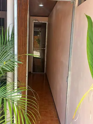 a hallway leading to a room with a door at Apartamentos y Studios Brisas del Mar Santa Teresa in Santa Teresa Beach