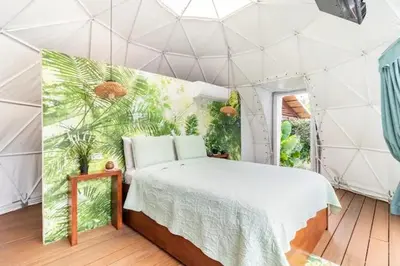 a bedroom with a bed in a tent at Ubuntu Glamping in Guanacaste