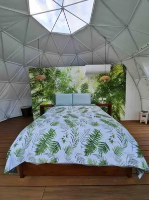 a bedroom with a large bed in a tent at Ubuntu Glamping in Guanacaste