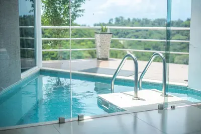 a swimming pool with two faucets in a house at Luxury Villa #12 Las Flores in Playa Hermosa