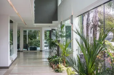 an empty hallway with plants in a house at Luxury Villa #13 De Los Monos with Jacuzzi in Playa Hermosa