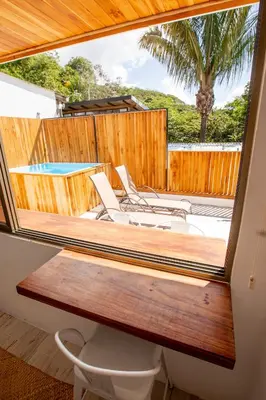 a view of a deck with chairs and a pool at Casa Manta - Santa Teresa in Santa Teresa Beach