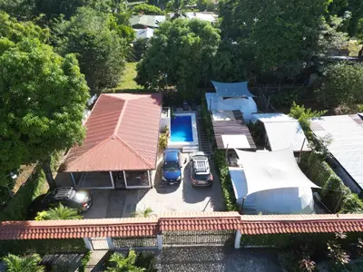 an aerial view of a house with a swimming pool at Mary's House in Libertad