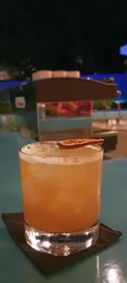 a drink sitting on a plate on a table at WET hotel - Adults Only in Tamarindo