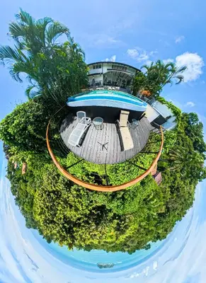 an aerial view of a house with a pool at Villa Roca Boutique Resort & Suites - ADULT ONLY in Manuel Antonio