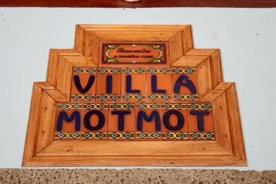 a wooden sign for a wild mote on a wall at 4BR Villa MotMot in w exclusive pool Wifi Ac in Quepos