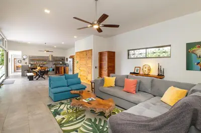 a living room with a couch and a table at Secret Mountain Top 3BR Casa Colibrí private pool in Quepos
