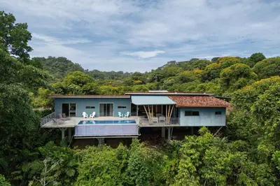 a house in the middle of a forest at Secret Mountain Top 3BR Casa Colibrí private pool in Quepos