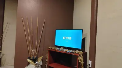 a television sitting on top of a fireplace at Río Celeste Nature View in Upala