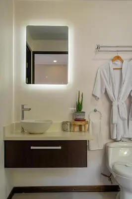 a bathroom with a sink and a mirror at House of Turri Suite Views Terrace & Jacuzzi in Verbena Norte