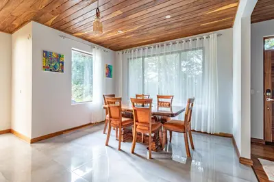 a dining room with a table and chairs at Cougar Monteverde in Monteverde Costa Rica