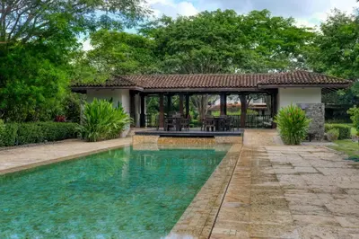 a swimming pool in front of a gazebo at Pinilla Flor de Malinche 15 in Tamarindo