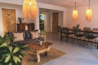 a living room with a couch and a table at Cuatro Vientos Lodge & Apartments - Santa Teresa, CR in Santa Teresa Beach