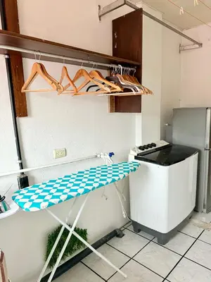 a shelf in a kitchen with shoes on it at Sweet Home Carrión in Fortuna