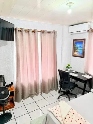 a room with a desk and a computer in it at Sweet Home Carrión in Fortuna