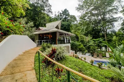 a resort with a gazebo and a pool at Lost Pools Bungalow at Sloth in Uvita