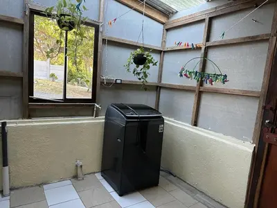 a trash can in a room with a window at Cabaña Rana Verde in Monteverde Costa Rica