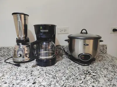 a coffee maker and a blender on a counter at Pura vida apartments in Quepos