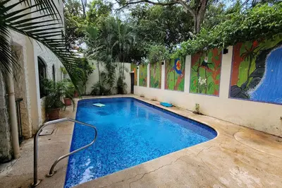 a swimming pool in the middle of a building at LA BUENA VIDA CONDO in Tamarindo