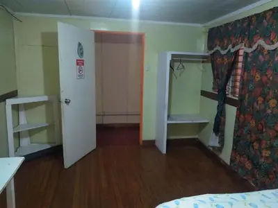 a room with a room with a bed and a door at Hotel Marruecos C.R. in San José