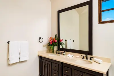 a bathroom with a sink and a mirror at Villa Estrella del Mar in Tamarindo