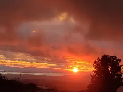 a sunset from the roof of a house at Ocean view in Monteverde Costa Rica