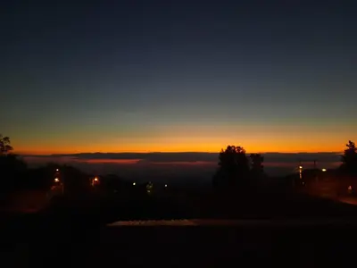 a view of a sunset from the roof of a house at Ocean view in Monteverde Costa Rica