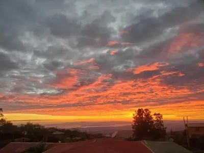 a sunset from the roof of a house at Ocean view in Monteverde Costa Rica
