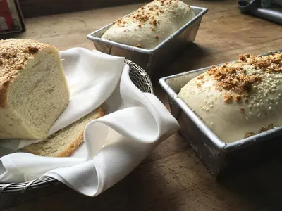 three trays of bread sitting on a table at Alta Las Palomas Hotel in San José