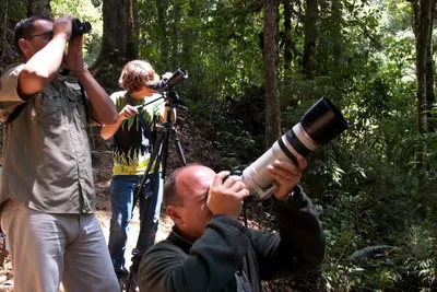 a man with a camera and a woman with a camera at Dantica Cloud Forest Lodge in San Gerardo de Dota