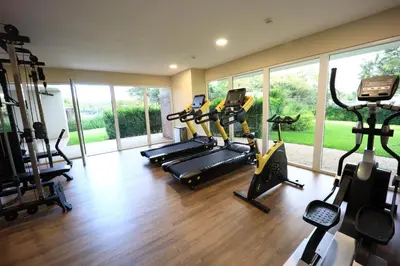 a gym with treadmills and ellipticals in a room at Brandnew Luxury 2Bdr condo✰Stunning view✰Fast wifi in Tamarindo