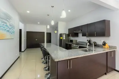 a kitchen with a sink and a counter top at Playa Tamarindo, CasaMar de Tamarindo in Tamarindo