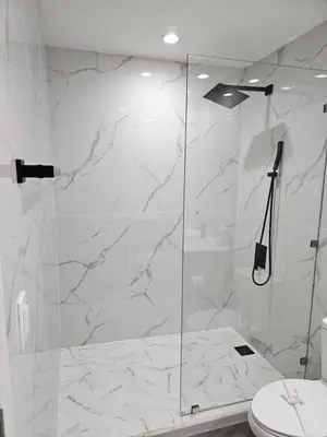 a bathroom with a glass shower with a toilet at Stunning 9th Flr Pacific Ocean and Mtn View in Jacó