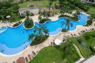 an overhead view of a pool at a resort at Stunning 9th Flr Pacific Ocean and Mtn View in Jacó
