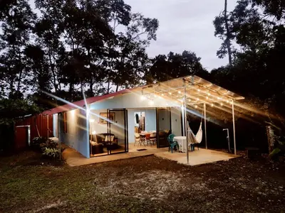 a small house with a lot of lights on it at Amphibia House in Agua Azul