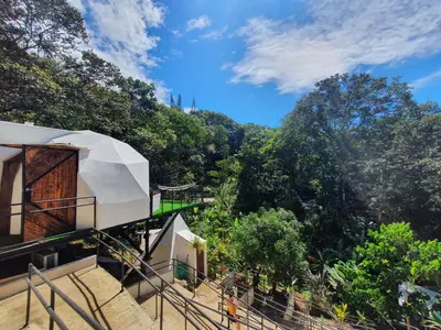 a group of stairs leading up to a building at Glamping Tomaselli in Manuel Antonio