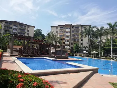 a swimming pool at a resort with buildings at Oceanview 6th Floor Jaco Condo in Jacó