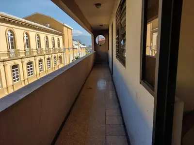 an empty corridor of a building with a balcony at Hotel Alajuela Costa Rica Airport in Alajuela City
