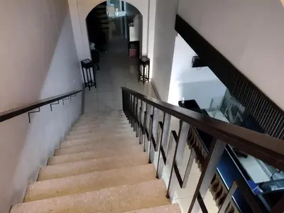 a staircase in a building with a stair case at Hotel Alajuela Costa Rica Airport in Alajuela City