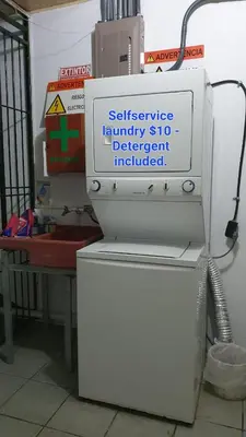 a white refrigerator with a sign on top of it at Sleep&Go! Apartamento 2 habitaciones 4 personas Siquirres centro in Siquirres