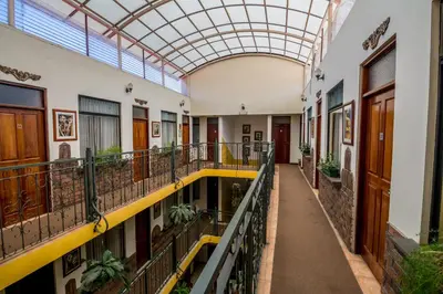 an empty hallway of a building with a glass ceiling at Hotel Amón Real Costa Rica in San José