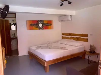 a bedroom with a bed in a room at Beach Front Bahia in Sámara