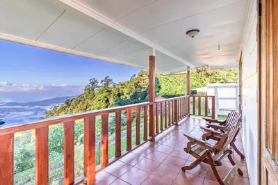 a porch with chairs and a view of the ocean at Refugio San Antonio - 1500 acre Private Preserve in Guaria