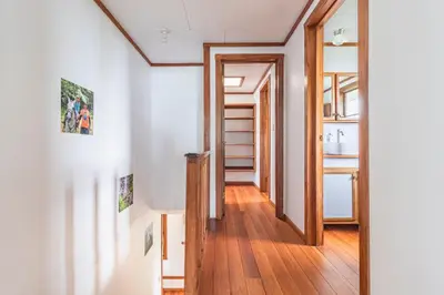 a hallway of a house with wooden floors at Refugio San Antonio - 1500 acre Private Preserve in Guaria