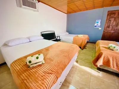 a room with two beds and a room with two beds at Nomads Family Rooms, Fortuna Town in Fortuna